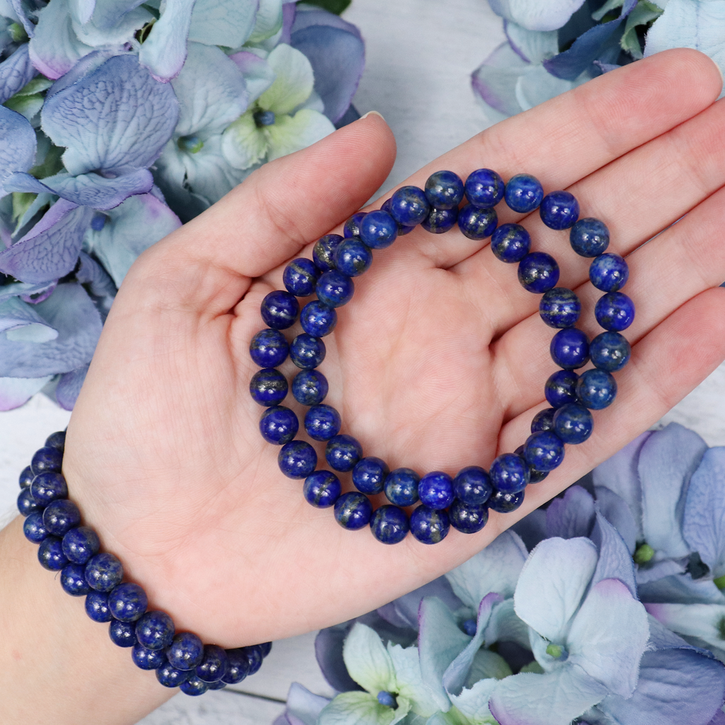 Lapis Lazuli crystal bracelet stacked with other Crystalvana pieces