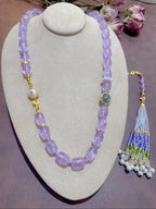 Lavender amethyst tassel necklace on bust display white background showing barrel beads, Crystalvana