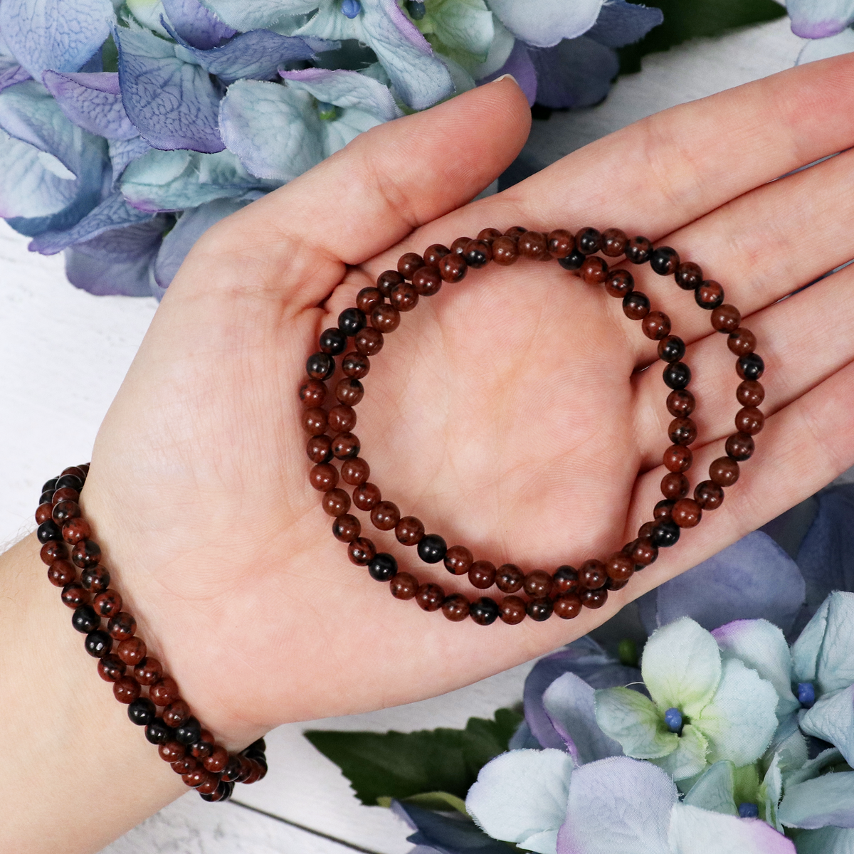 Close-up of natural Mahogany Obsidian beads showing colour and pattern