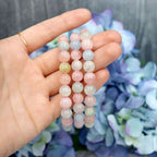 Morganite crystal bracelet stacked with other Crystalvana pieces