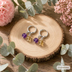 Natural amethyst and citrine S925 silver dangle earrings close-up on branch nature background, Crystalvana