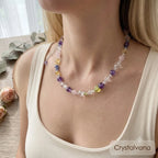 Pastel multi-gemstone crystal choker on wood display showing amethyst citrine rose quartz sodalite beads, Crystalvana