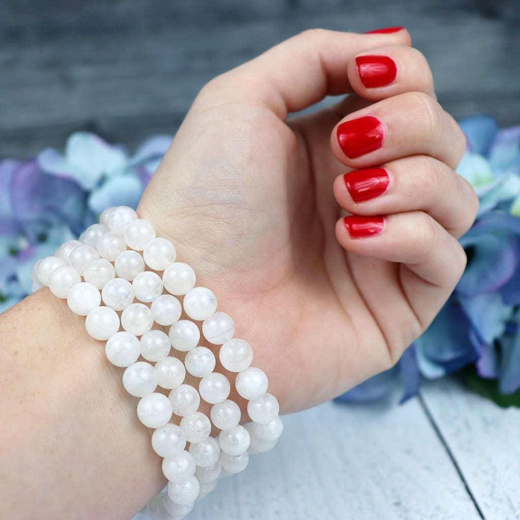 Close-up of natural Rainbow Moonstone beads showing colour and pattern