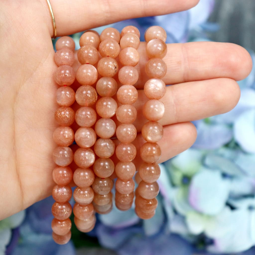 Sunstone crystal bracelet stacked with other Crystalvana pieces